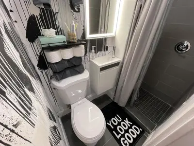 a small bathroom with a toilet and a shower at Studio in Design District in Miami