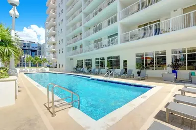 a swimming pool in front of a building at Prime Brickell Stay with Pool Gym & Parking in Miami
