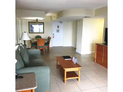 a living room with a couch and a table at 2 BR-11th Floor Corner Unit - Fort Lauderdale Beach Resort in Fort Lauderdale