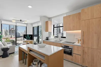a kitchen with wooden cabinets and a view of a city at Central Downtown Miami Condo Featuring Rooftop Pool in Miami
