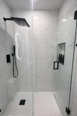 a shower with a glass door in a bathroom at Luxury 2BR Miami Retreat King Suite Free Parking in Miami
