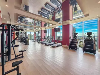 a gym with treadmills and exercise equipment in a building at MIA Worldcenter Premium 1BR Balcony & Rooftop Pool in Miami