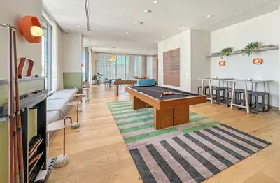 a living room with a ping pong table in it at MIA Worldcenter Premium 1BR Balcony & Rooftop Pool in Miami