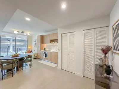 a kitchen and dining room with a table and chairs at MIA Worldcenter Premium 1BR Balcony & Rooftop Pool in Miami