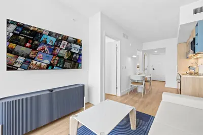 a living room with a couch and a table at City-View Condo W Pool Access & Free Parking in Miami