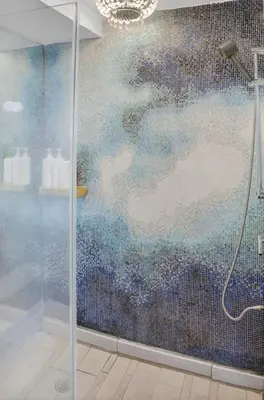 a shower with a glass door in a bathroom at Mondrian in Miami Beach