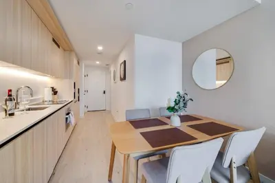 a kitchen and dining room with a table and chairs at Sky Corner Residence- Pool Parking Amenities in Miami