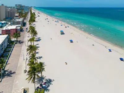 an overhead view of a beach with palm trees and the ocean at Vista Del Mar - by Atlantikos in Hollywood