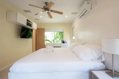 a bedroom with two beds and a ceiling fan at Vista Del Mar - by Atlantikos in Hollywood