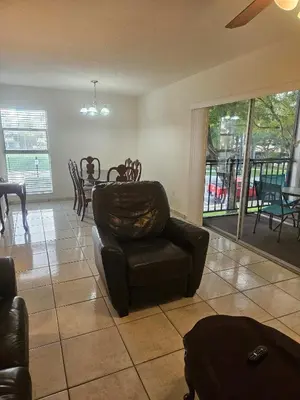 a living room with a couch and a chair at Le Cartier 207 STR-02440 in Sunny Isles Beach