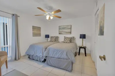 a bedroom with a bed and a ceiling fan at Le Frontenac 204 STR-01054 in Sunny Isles Beach