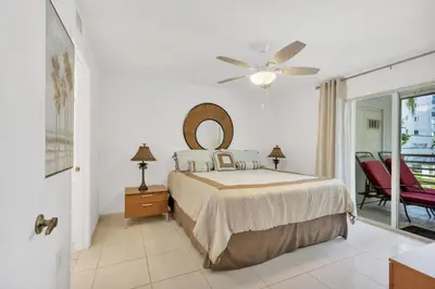 a bedroom with a bed and a ceiling fan at Le Frontenac 204 STR-01054 in Sunny Isles Beach