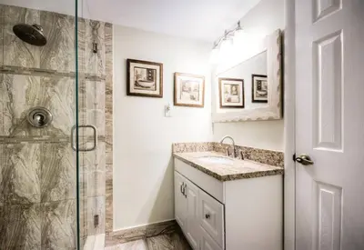 a bathroom with a sink and a shower at Le Frontenac 205 STR-01057 in Sunny Isles Beach