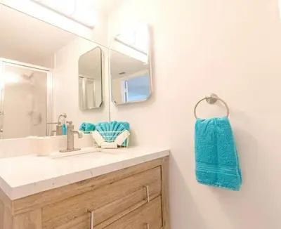a bathroom with a sink and a mirror at Le Frontenac in Sunny Isles unit 402 STR-03003 in Sunny Isles Beach