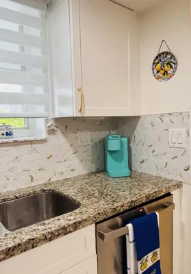 a kitchen with a sink and a counter top at Le Frontenac in Sunny Isles unit 402 STR-03003 in Sunny Isles Beach