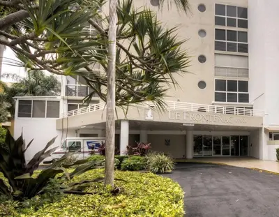 a palm tree in front of a building at Le Frontenac 413 STR-03005 in Sunny Isles Beach