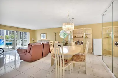 a kitchen and dining room with a table and chairs at Le Frontenac 414 STR-01532 in Sunny Isles Beach