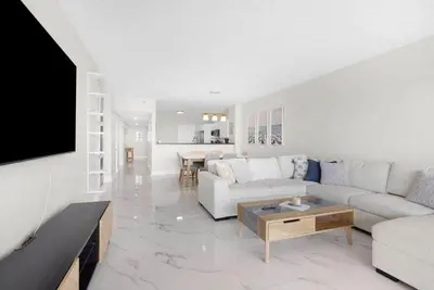 a living room with a couch and a table at Le Golden Bay 902 STR-00876 in Sunny Isles Beach
