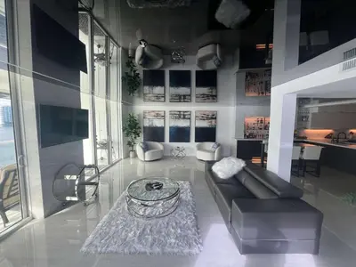 a living room with a couch and a table at Le Marina Bay 1001 STR-01504 in Sunny Isles Beach
