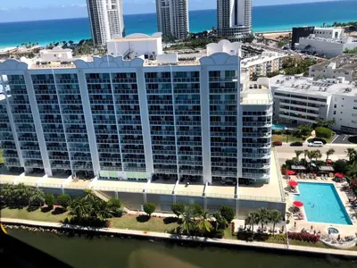 an aerial view of a large building with a pool at Le Marina Bay 1006 STR-01435 in Sunny Isles Beach