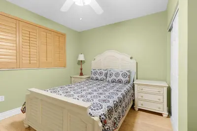 a bedroom with a bed and two night stands at Le Marina Bay 1106 STR-03006 in Sunny Isles Beach