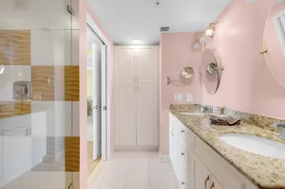 a bathroom with a sink and a mirror at Le Marina Bay 1106 STR-03006 in Sunny Isles Beach