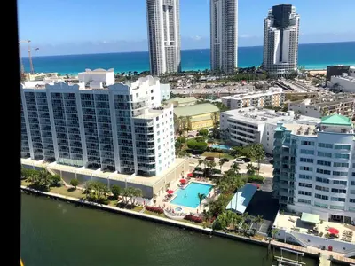an aerial view of a city with buildings and a pool at Le Marina Bay 407 STR-01404 in Sunny Isles Beach