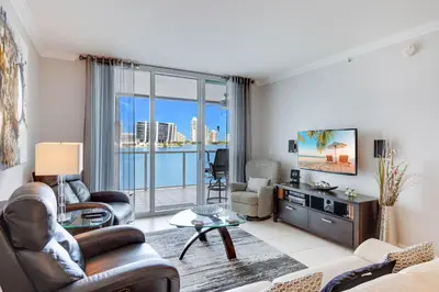 a living room with a view of the ocean at Le Marina Bay 505 STR-02744 in Sunny Isles Beach