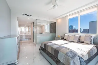 a bedroom with a bed and a large window at Le Marina Bay 701 STR-01254 in Sunny Isles Beach
