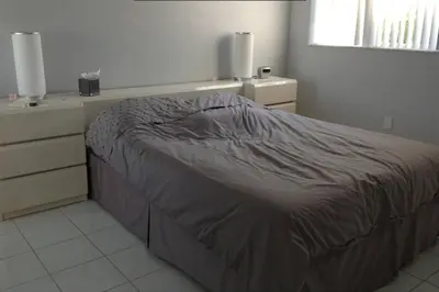 a bedroom with a bed and a dresser at Le Montcalm 102 STR-01921 in Sunny Isles Beach