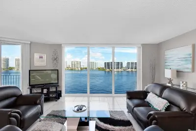 a living room with a view of the water at Le Montcalm 804 STR-01923 in Sunny Isles Beach