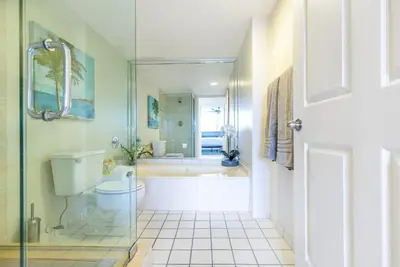 a bathroom with a tub and a toilet and a shower at Le Montcalm 804 STR-01923 in Sunny Isles Beach