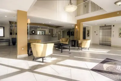 a lobby with chairs and a table in a building at Le Marina Bay 810 STR-01434 in Sunny Isles Beach