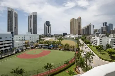 a baseball field in the middle of a city at Le Marina Bay 810 STR-01434 in Sunny Isles Beach