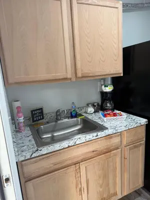 a kitchen with a sink and a counter top at Modern private efficiency Miami Gardens in Miami Gardens