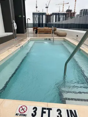 a swimming pool on the roof of a building at District 225 in Miami
