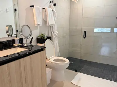 a bathroom with a toilet and a shower at District 225 in Miami