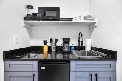 a kitchen with a sink and a counter top at Comfy Studio W Essentials Near Airport in Miami