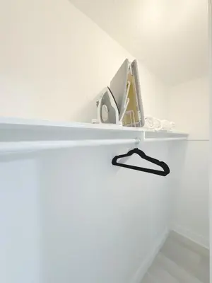 a white shelf in a white room with at Beachside Escape with King Bed plus 2 Queens Miami in Miami Beach