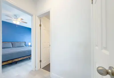 a bedroom with a bed and a ceiling fan at Beachside Escape with King Bed plus 2 Queens Miami in Miami Beach