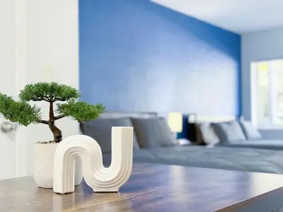 a room with a couch and a table with aotted tree at Beachside Escape with King Bed plus 2 Queens Miami in Miami Beach