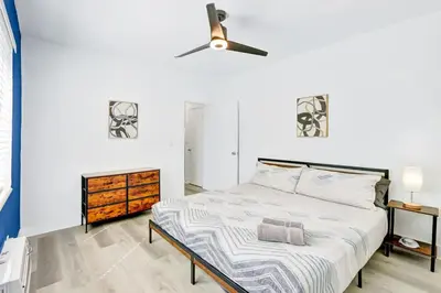 a bedroom with a bed and a ceiling fan at Bright 1BR Miami Beach Stay Near the Ocean in Miami Beach