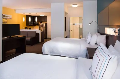 a hotel room with two beds and a kitchen at Residence Inn by Marriott Miami West/FL Turnpike in Miami