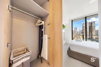 a bedroom with a bed and a large window at Downtown Miami - Luxury Condo with City Views in Miami