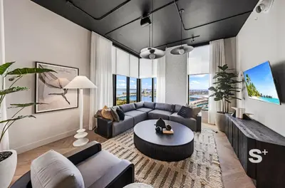 a living room with a couch and a table at Cozy and Spacious Studio in Miami City Views in Miami