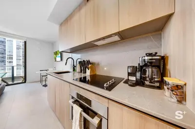 a kitchen with a sink and a counter top at Cozy and Spacious Studio in Miami City Views in Miami