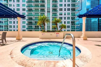 a hot tub on the roof of a building at Bright Escape Near Hot Spots in Miami