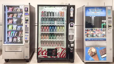 two soda machines in a store with drinks at Great 2BR Condo-DIRECT BEACH ACCESS Pool, Gym and FREE Parking in Hollywood
