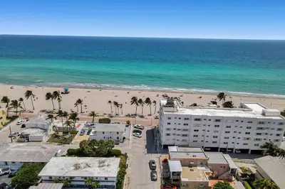an aerial view of a beach and a building at Oceanfront Residence by Atlantikos in Hollywood