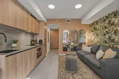 a large living room with a couch and a kitchen at New Luxury Studio Downtown Miami Prime Location in Miami